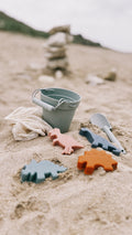 Set de plage silicone thème dinosaure – seau pelle et 4 moules T-rex stégosaure tricératops brachiosaure – jouet silicone pliable cadeau petit explorateur
